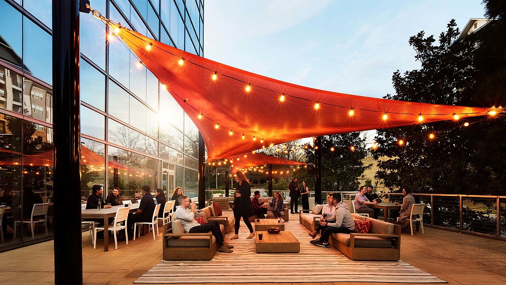 A group of people sitting outside.